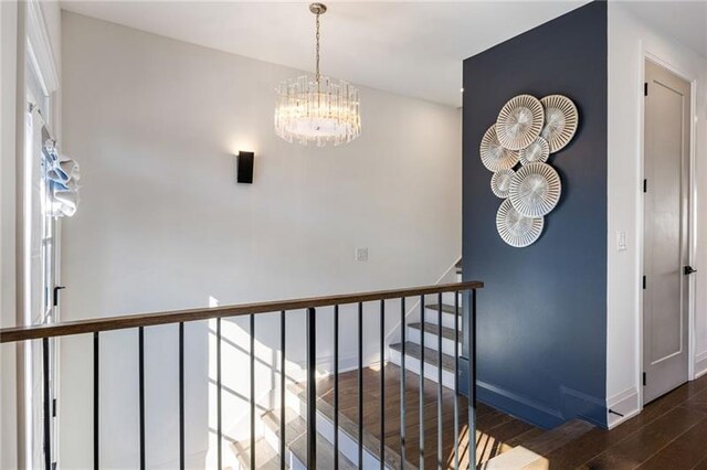 726 Edgewood Ave NE, Atlanta, GA 30307 - interior space featuring a chandelier, baseboards, wood finished floors, and stairs
