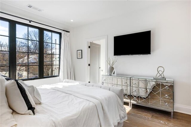 726 Edgewood Ave NE, Atlanta, GA 30307 - bedroom featuring wood finished floors, visible vents, and baseboards