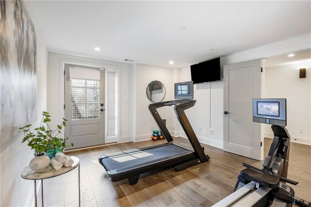 726 Edgewood Ave NE, Atlanta, GA 30307 - workout area featuring a wealth of natural light, wood finished floors, and baseboards
