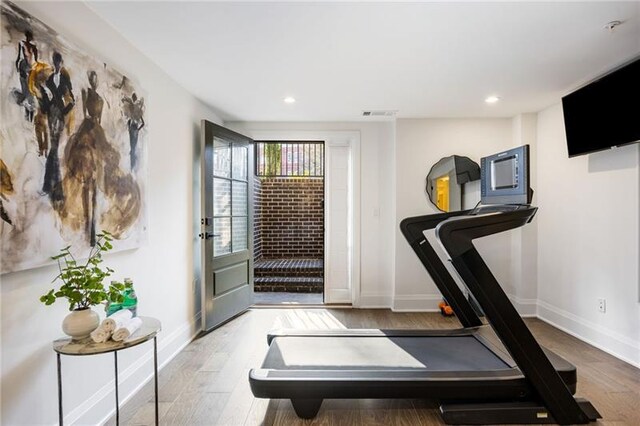 726 Edgewood Ave NE, Atlanta, GA 30307 - exercise room featuring recessed lighting, wood finished floors, and baseboards