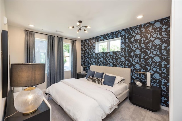 392 Pratt Dr Unit 2014, Atlanta, GA 30315 - carpeted bedroom featuring an accent wall, wallpapered walls, a chandelier, and recessed lighting