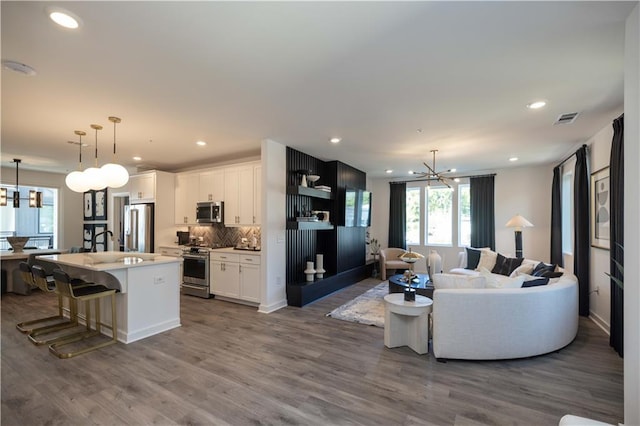 392 Pratt Dr Unit 2014, Atlanta, GA 30315 - living area with a chandelier, plenty of natural light, dark wood-style floors, and recessed lighting