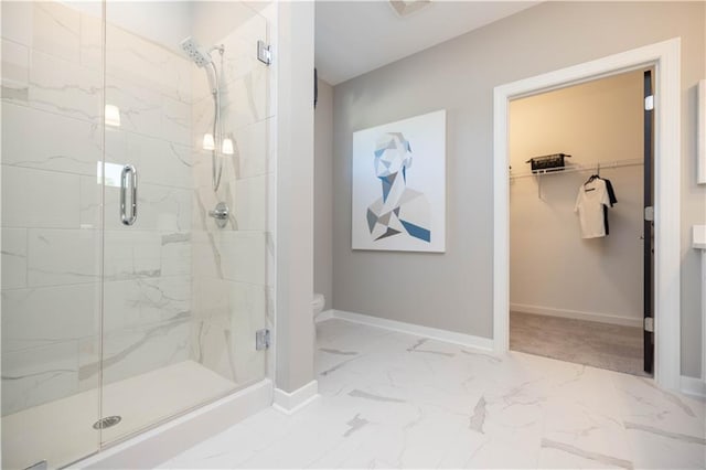 392 Pratt Dr Unit 2014, Atlanta, GA 30315 - bathroom with a marble finish shower, marble finish floors, and a walk in closet