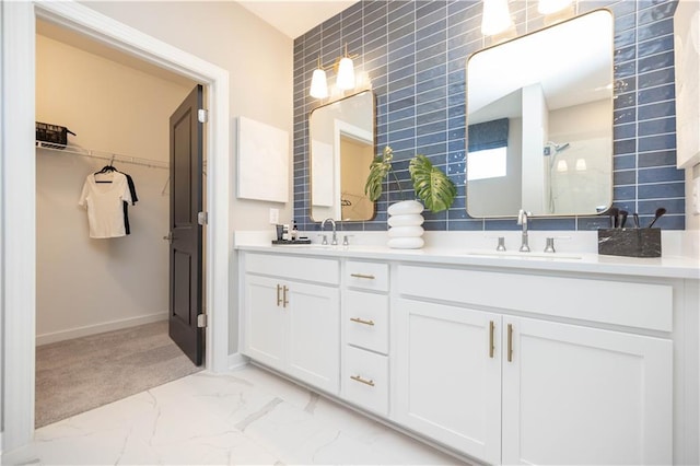 392 Pratt Dr Unit 2014, Atlanta, GA 30315 - bathroom featuring double vanity, marble finish flooring, a shower, a spacious closet, and tile walls