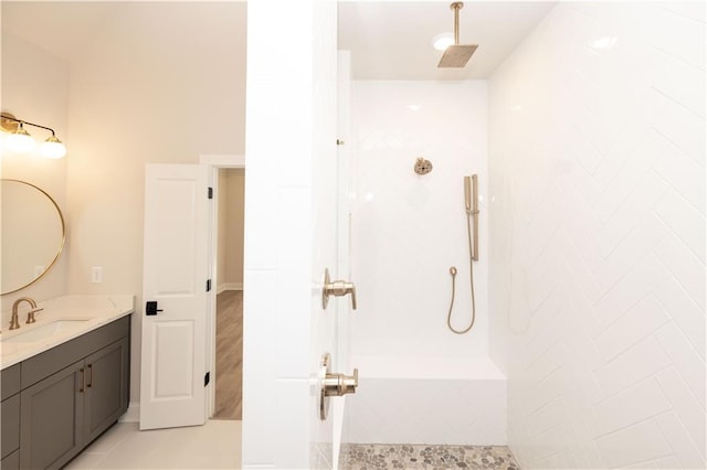 bathroom featuring vanity and a shower