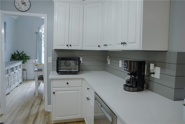 6985 Shane Ln, Cumming, GA 30028 - kitchen with dishwasher, white cabinetry, and light wood-type flooring