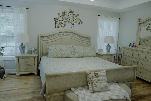 6985 Shane Ln, Cumming, GA 30028 - bedroom with wood finished floors and crown molding
