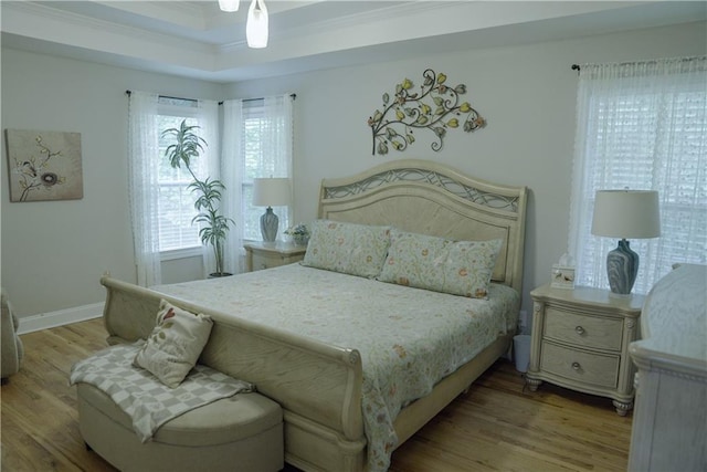 6985 Shane Ln, Cumming, GA 30028 - bedroom with wood finished floors, crown molding, and baseboards
