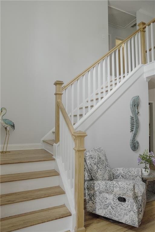 6985 Shane Ln, Cumming, GA 30028 - stairway with wood finished floors, crown molding, and baseboards