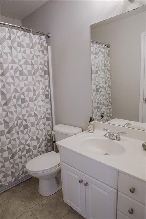 6985 Shane Ln, Cumming, GA 30028 - full bathroom with vanity, tile patterned flooring, and toilet