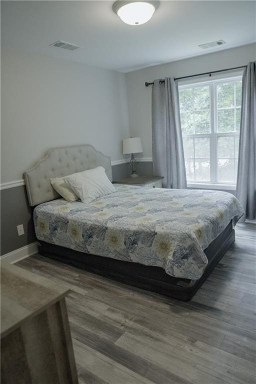 6985 Shane Ln, Cumming, GA 30028 - bedroom with wood finished floors and baseboards