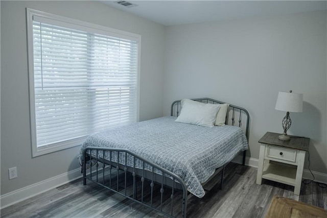 6985 Shane Ln, Cumming, GA 30028 - bedroom featuring wood finished floors and baseboards