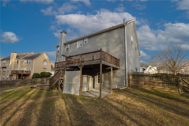 back of house featuring a yard, stairway, a fenced backyard, and a wooden deck