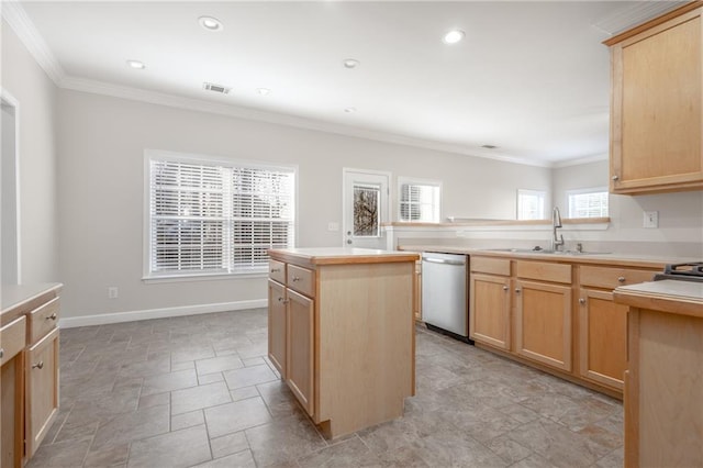 kitchen with dishwasher, light brown cabinets, visible vents, and a sink