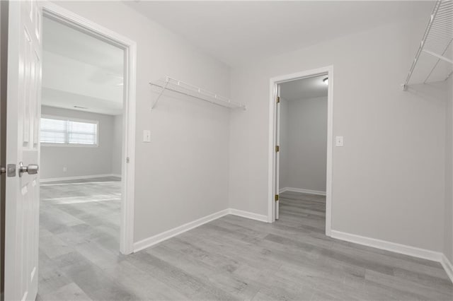 spacious closet featuring wood finished floors