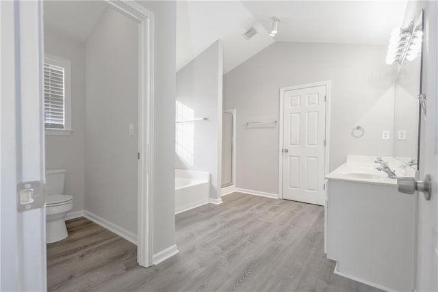 full bathroom with a garden tub, toilet, wood finished floors, visible vents, and a shower stall