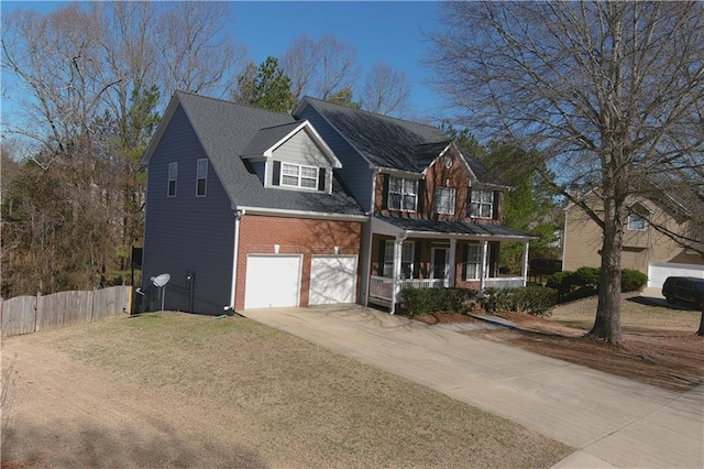 view of front of home with a porch, an attached garage, brick siding, fence, and driveway