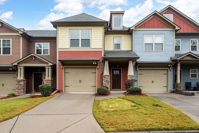 townhome / multi-family property with a garage and concrete driveway