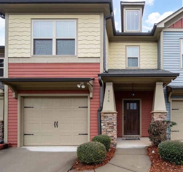 property entrance featuring stone siding and covered porch