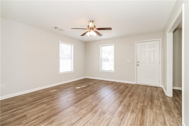 spare room with ceiling fan and light hardwood / wood-style flooring