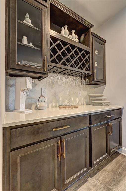 13 Clearwater Ct, Hoschton, GA 30548 - indoor dry bar with tasteful backsplash, light wood finished floors, and baseboards