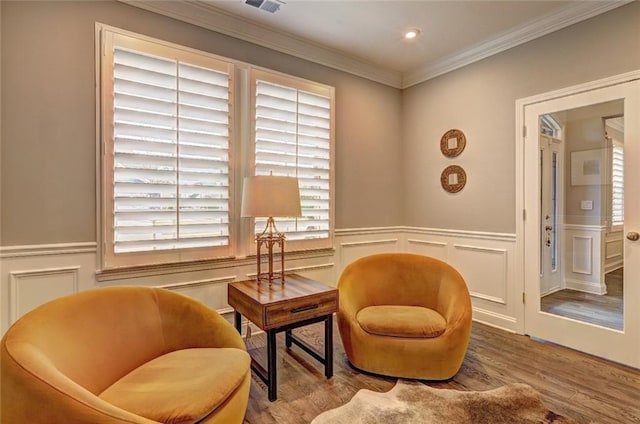 13 Clearwater Ct, Hoschton, GA 30548 - sitting room with crown molding, a decorative wall, wood finished floors, and a wainscoted wall