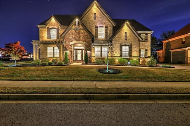 13 Clearwater Ct, Hoschton, GA 30548 - view of front facade with a lawn, stone siding, and brick siding