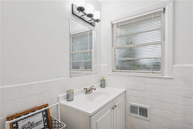 2858 Valley Ridge Dr, Decatur, GA 30032 - bathroom featuring tile walls, vanity, and a wainscoted wall