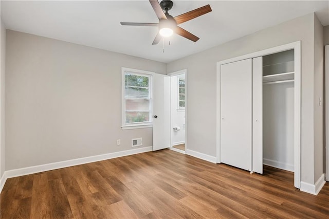 2858 Valley Ridge Dr, Decatur, GA 30032 - unfurnished bedroom with wood finished floors, baseboards, a closet, and a ceiling fan