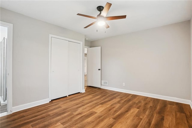 2858 Valley Ridge Dr, Decatur, GA 30032 - unfurnished bedroom featuring wood finished floors, baseboards, a closet, and a ceiling fan