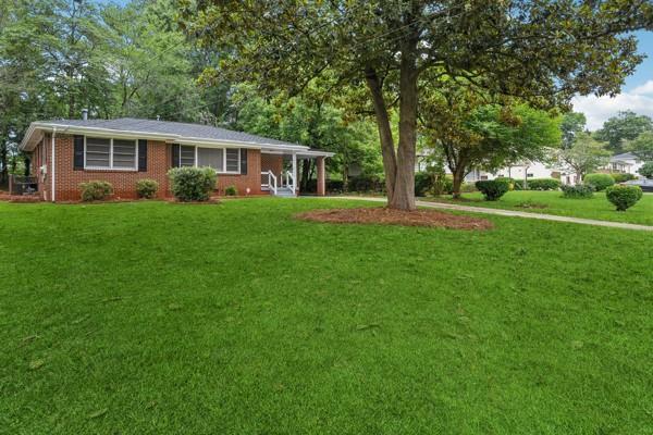 2858 Valley Ridge Dr, Decatur, GA 30032 - view of front of home featuring a front yard and brick siding