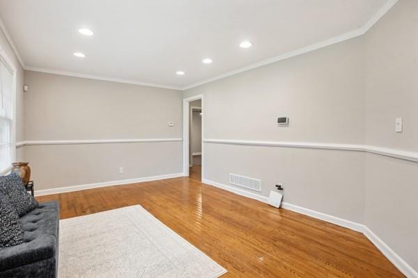 2858 Valley Ridge Dr, Decatur, GA 30032 - living area with wood finished floors, baseboards, crown molding, and recessed lighting