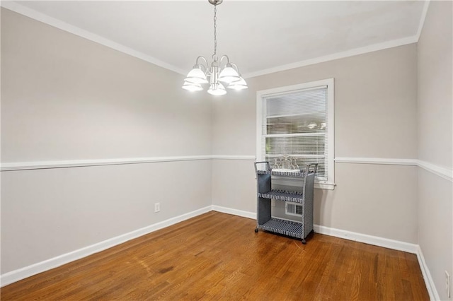 2858 Valley Ridge Dr, Decatur, GA 30032 - unfurnished dining area featuring a chandelier, wood finished floors, baseboards, and crown molding