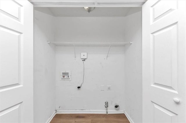 clothes washing area featuring gas dryer hookup, laundry area, hookup for a washing machine, electric dryer hookup, and dark wood-style flooring