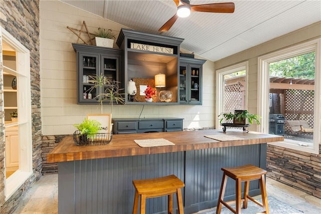 3578 Hope Rd, Cumming, GA 30041 - bar with ceiling fan, vaulted ceiling, and stone finish flooring