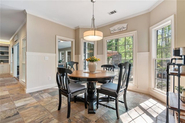 3578 Hope Rd, Cumming, GA 30041 - dining area with a decorative wall, visible vents, wainscoting, and stone tile floors