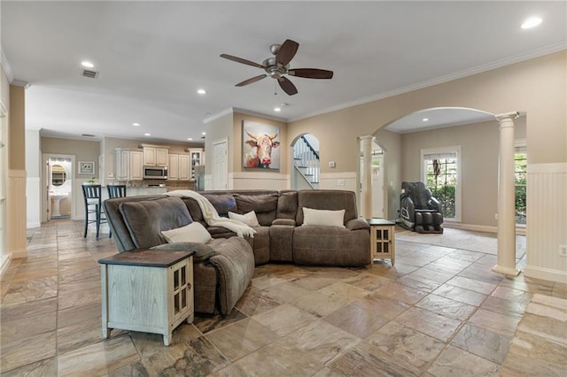 3578 Hope Rd, Cumming, GA 30041 - living room with arched walkways, ceiling fan, decorative columns, recessed lighting, and stone tile floors