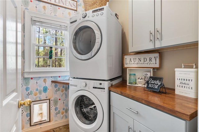 3578 Hope Rd, Cumming, GA 30041 - clothes washing area featuring stacked washer and dryer and cabinet space