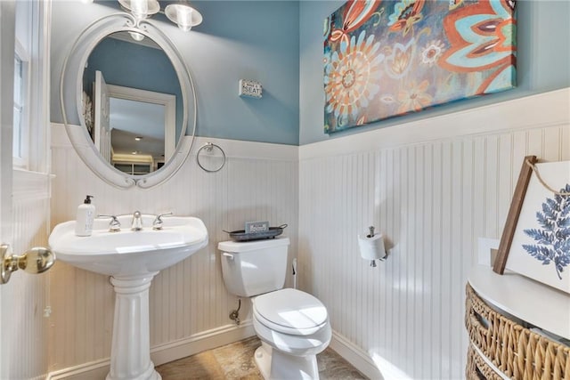 3578 Hope Rd, Cumming, GA 30041 - half bathroom featuring toilet, a sink, and a wainscoted wall