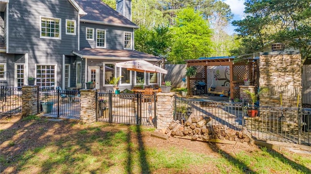 3578 Hope Rd, Cumming, GA 30041 - rear view of property featuring fence private yard, a chimney, and a gate