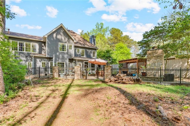 3578 Hope Rd, Cumming, GA 30041 - back of property featuring a chimney and fence