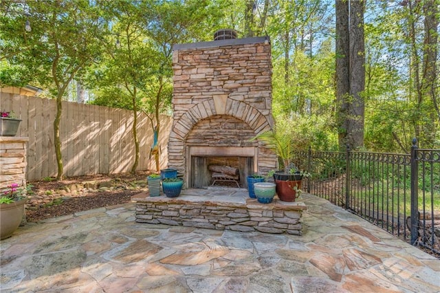 3578 Hope Rd, Cumming, GA 30041 - view of patio featuring a fenced backyard and an outdoor stone fireplace
