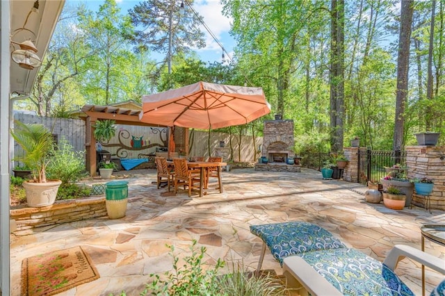 3578 Hope Rd, Cumming, GA 30041 - view of patio / terrace featuring outdoor dining area, an outdoor stone fireplace, and fence