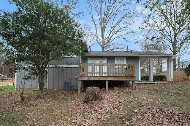 back of house featuring a wooden deck and central AC