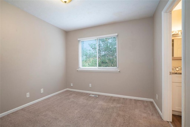 view of carpeted spare room