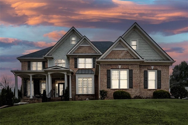 craftsman-style house featuring a yard