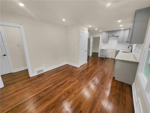 1955 S Columbia Pl, Decatur, GA 30032 - kitchen with a sink, dark wood-type flooring, gray cabinetry, and recessed lighting