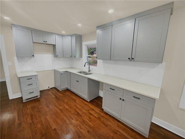 1955 S Columbia Pl, Decatur, GA 30032 - kitchen with tasteful backsplash, gray cabinetry, dark wood finished floors, recessed lighting, and a sink