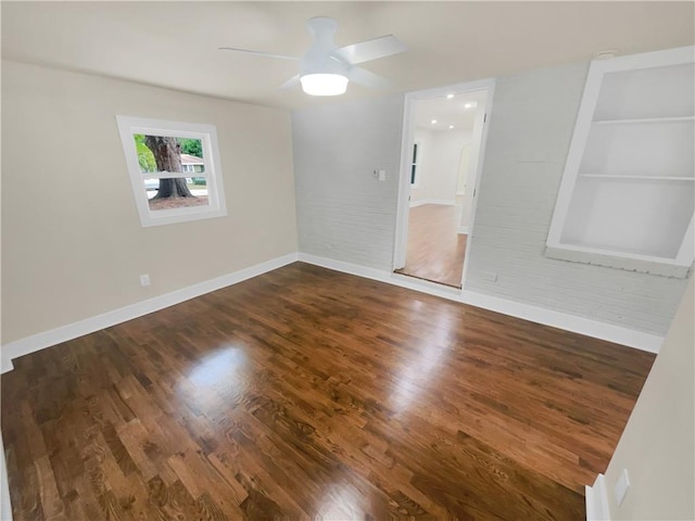 1955 S Columbia Pl, Decatur, GA 30032 - empty room featuring built in features, baseboards, wood finished floors, and a ceiling fan