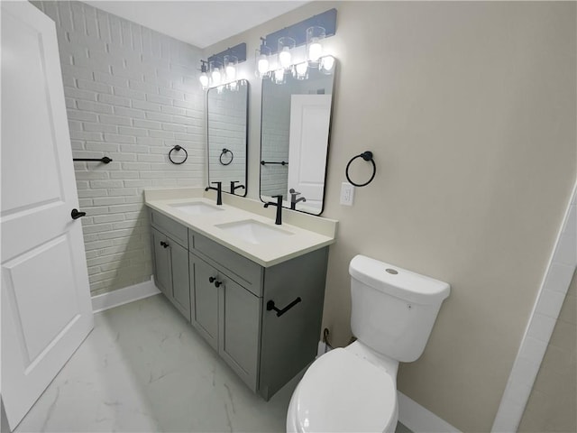 1955 S Columbia Pl, Decatur, GA 30032 - full bathroom featuring marble finish floor, toilet, and a sink